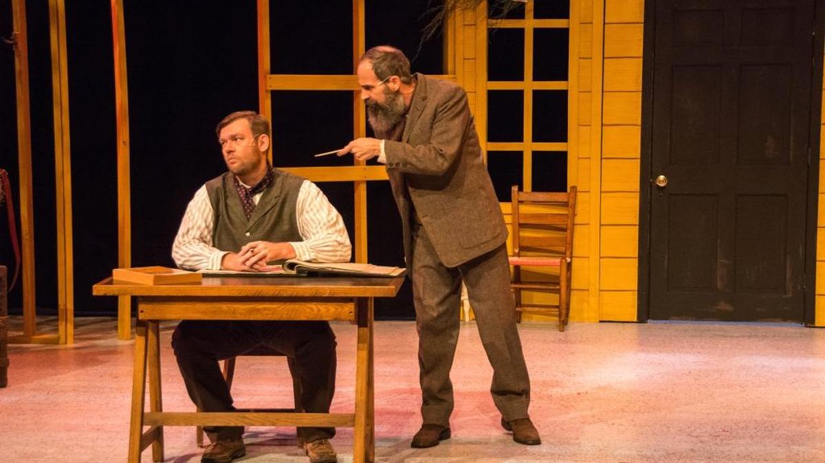 Jason Meenach as Bob Cratchit and Adam Luckey as Eb Scrooge in The Woodford Theatre’s production of “An Appalachian Christmas Carol.”