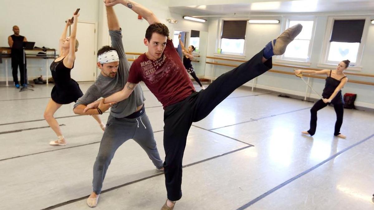 Jake Lowenstein, left, and Casey Myrick rehearsed a move for the Lexington Ballet’s production of “The Soldier’s Tale.”