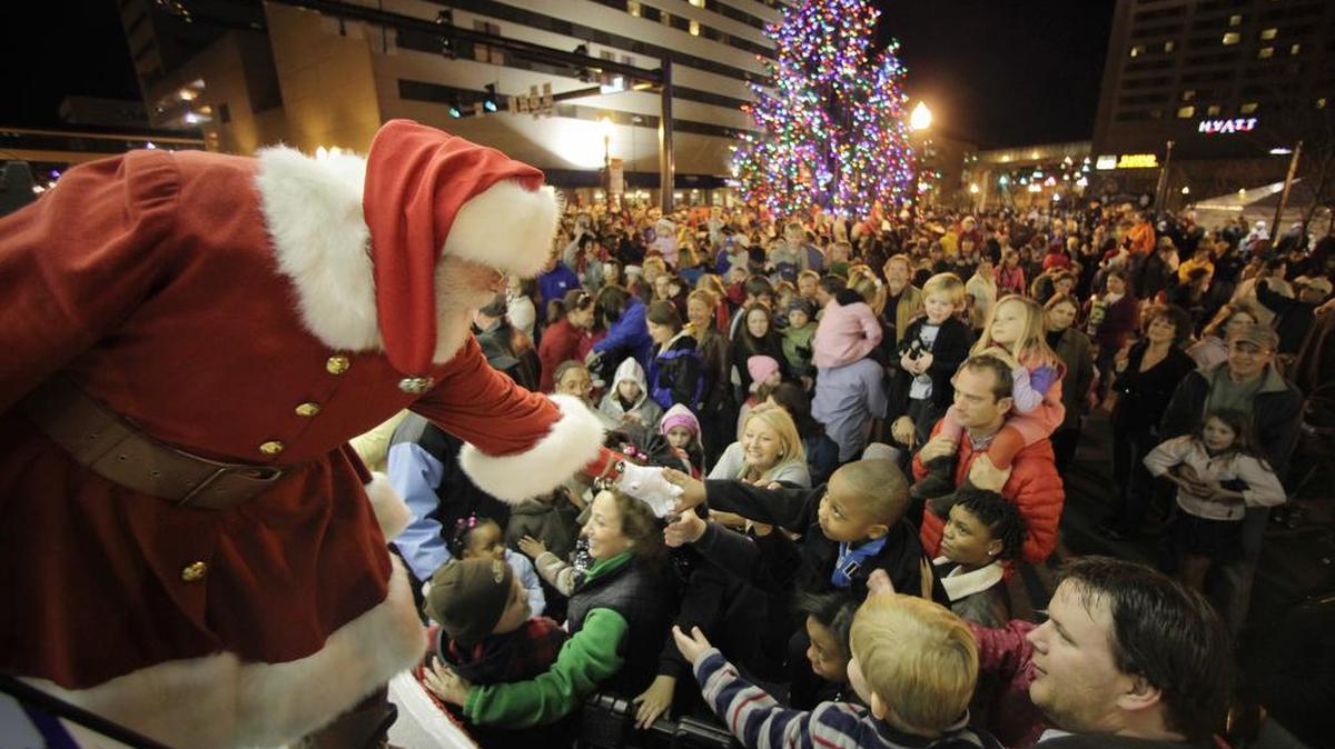 Santa Claus greeted children after he turned on the Christmas lights with Lexington Mayor Jim Gray at Triangle Park on Nov. 11, 2011. The tree lighting festival included an artist’s market, visits with Santa, carriage rides and ice skating.