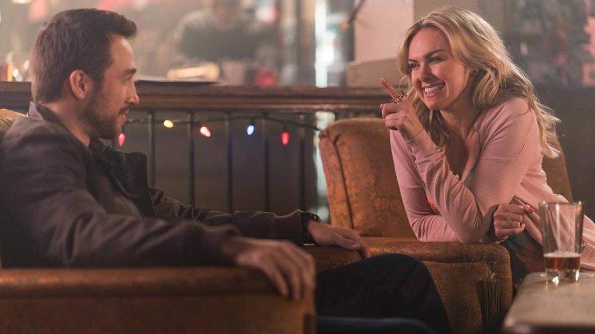 Baker Emily (Laura Bell Bundy, right) and her competitor Gerrard (Brendon Zub) chat in a bar in “The Christmas Calendar.”