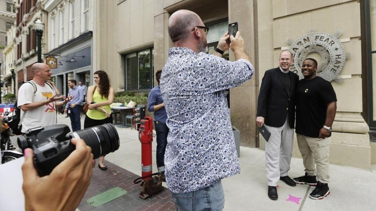 Shawn Gannon photographed the Rev. Brian Cole, rector for Good Shepherd Episcopal Church, left, and Adrian Wallace, vice president of Lexington-Fayette NAACP, during an unveiling of "Unlearn Fear + Hate" in front of 21c Museum Hotel in Lexington.