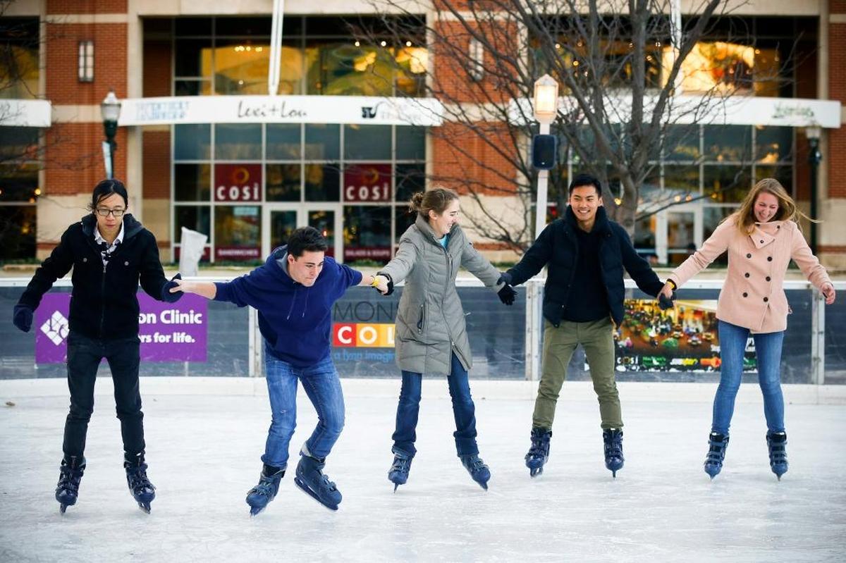 From left, Asbury University students Michaih Li of Guangzhou, China; Dominic D’Ettorre, Tricia Taylor and Josh Hou, all of Wilmore; and Julia Conley of Smithfield., Va., skated Dec. 6 on the Unified Trust Co. ice rink at Triangle Park in downtown Lexington in 2017.
