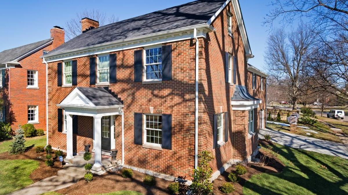 This two-story brick home is on a corner lot, which appealed to the homeowners who recently expanded it with two-level addition.