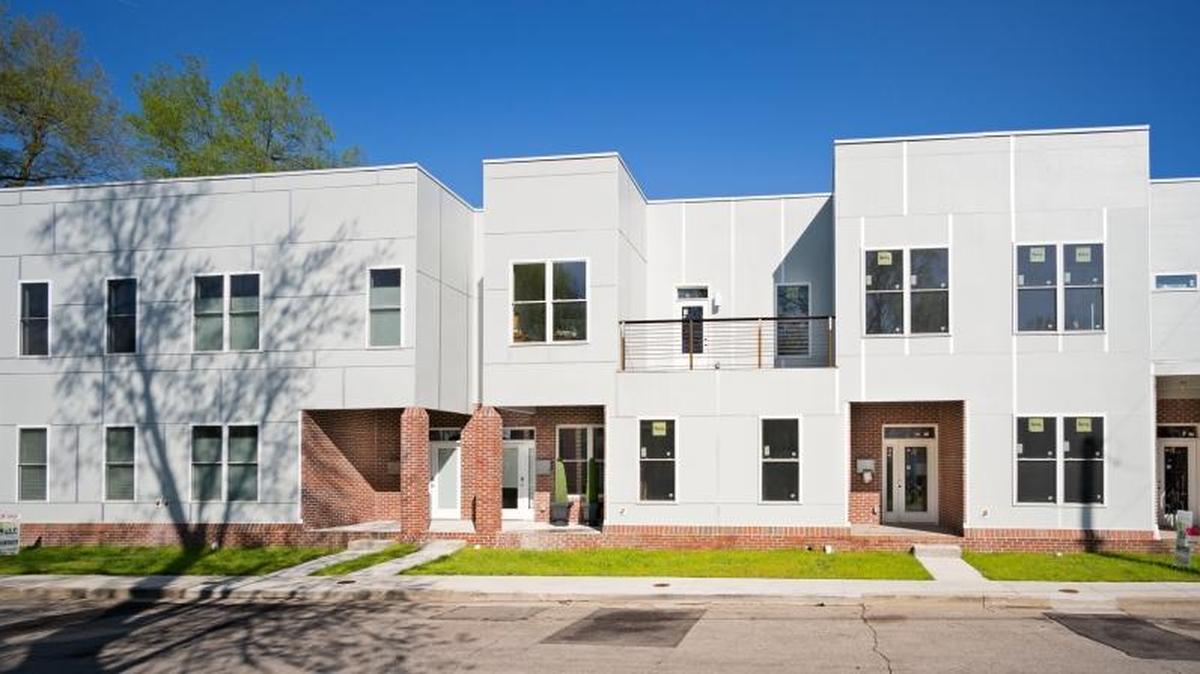 Smith Town Homes is a new five-unit development boasting a contemporary exterior that includes galvanized metal, brick and steel.