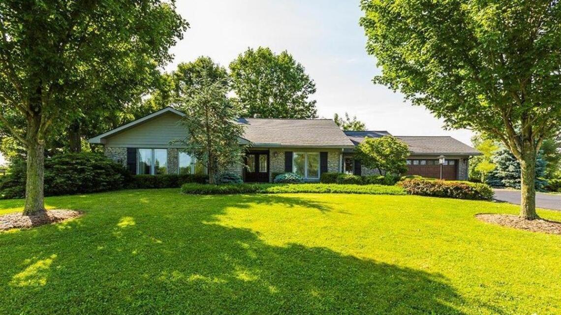 Quintessentially Kentucky home on ten acres with horse barn