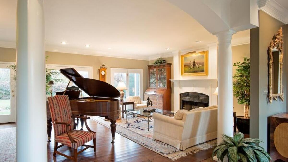 The center of the open living room and dining area is framed by two entry pillars.