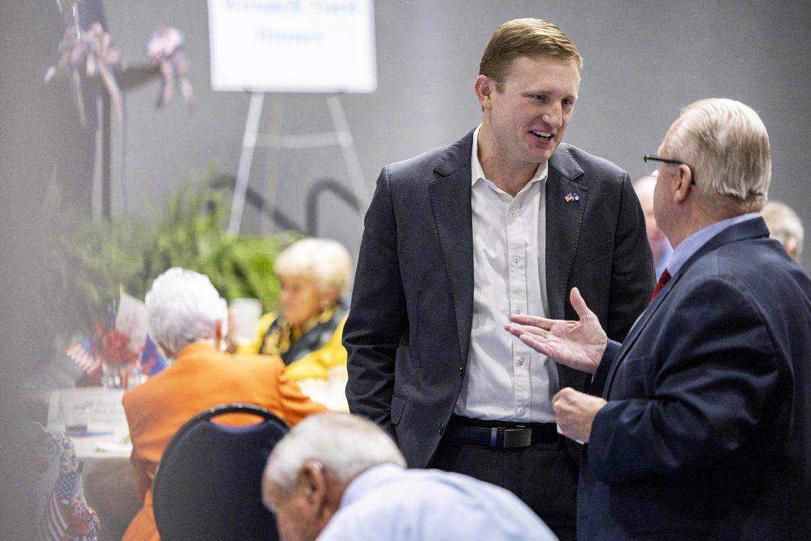 Zach Dembo, a candidate for the sixth district, center, speaks with attendees during the annual Wendell H. Ford Dinner on Tuesday, Sept. 30, 2025, at Clay Community Center in Mt. Sterling, Ky.