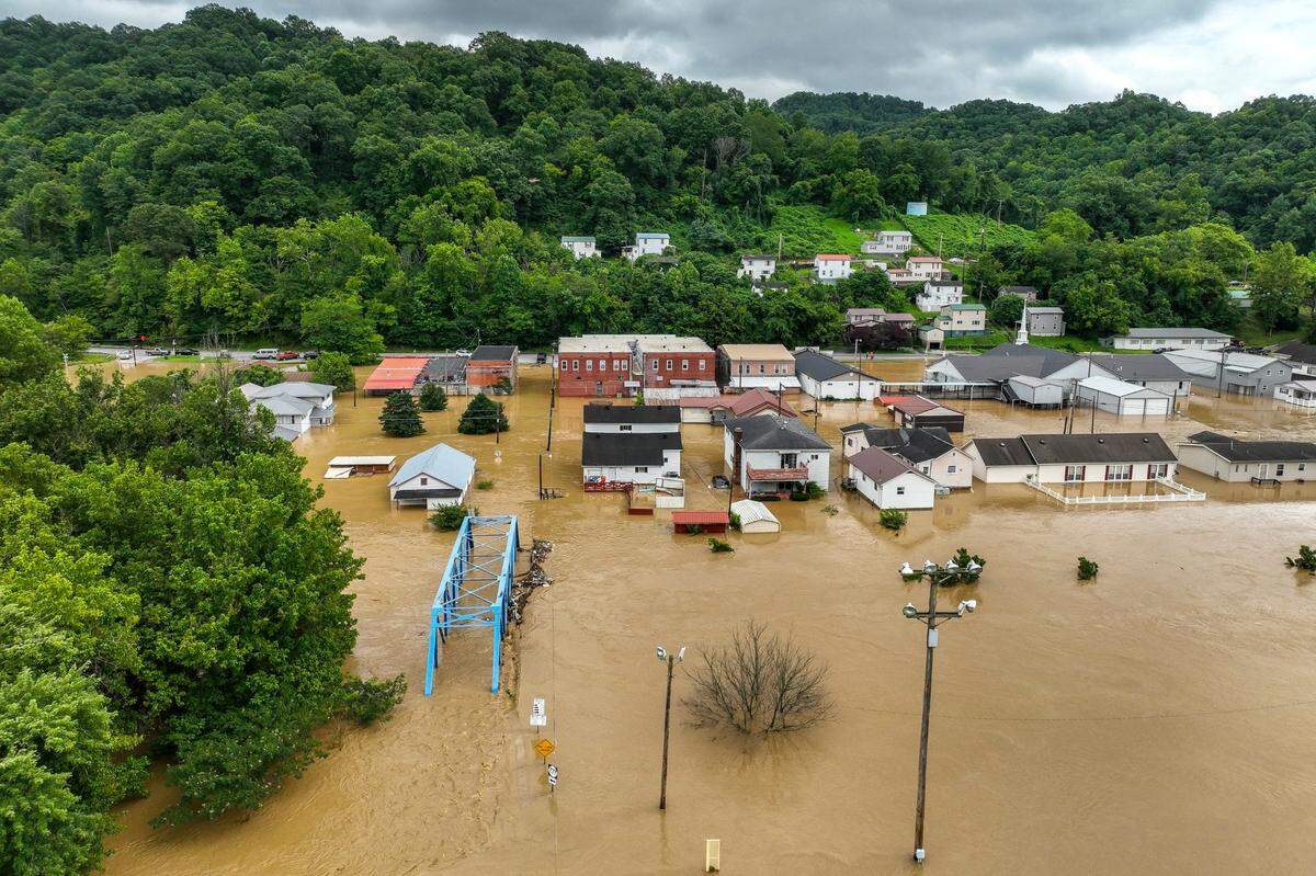 Buildings and roads are flooded in downtown Garrett, Ky., on Thursday, July 28, 2022. 