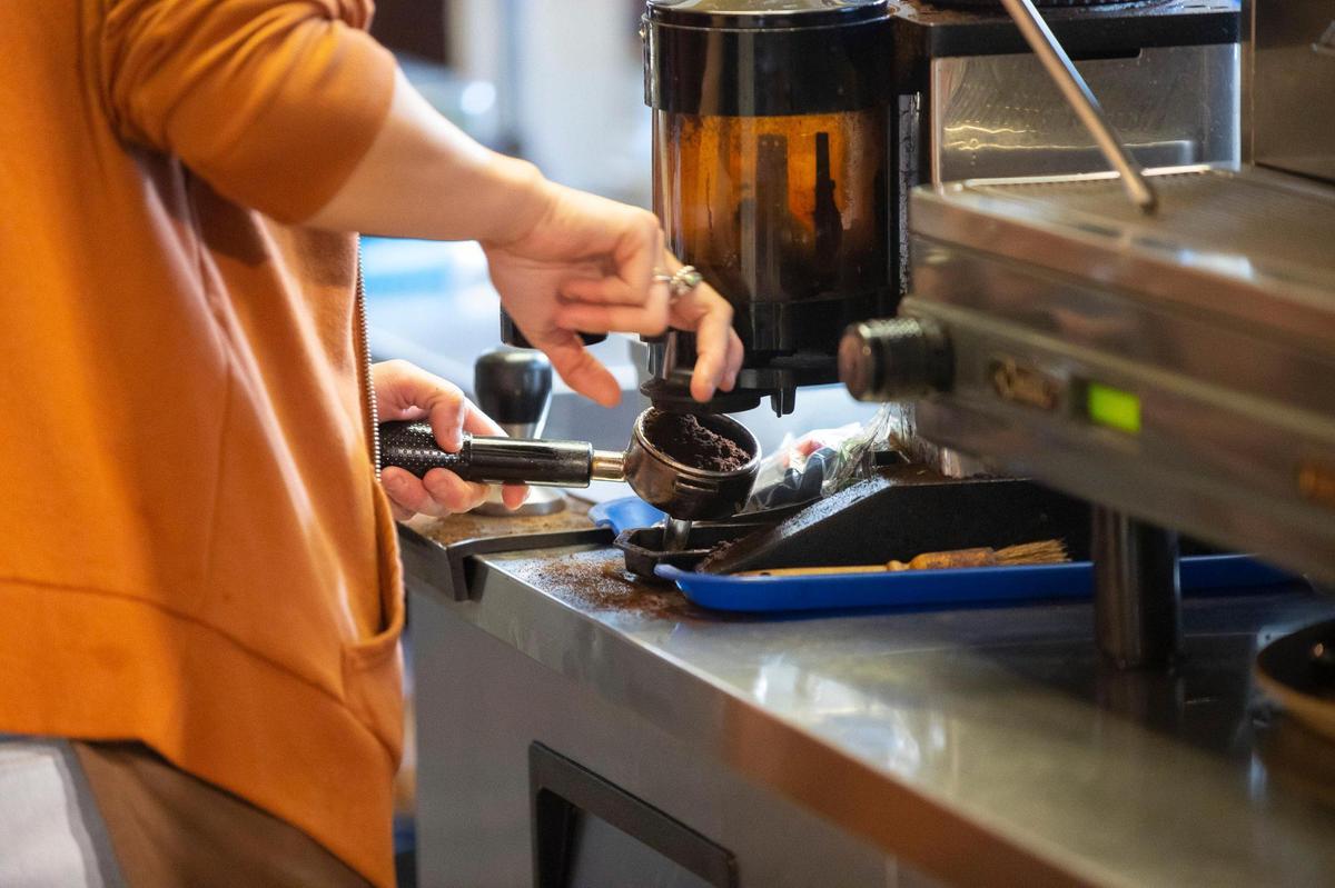 Meghan Rader prepares coffee for a drink at High on Art & Coffee at 523 East High St. in Lexington, Ky., on Thursday, Oct. 21, 2021.