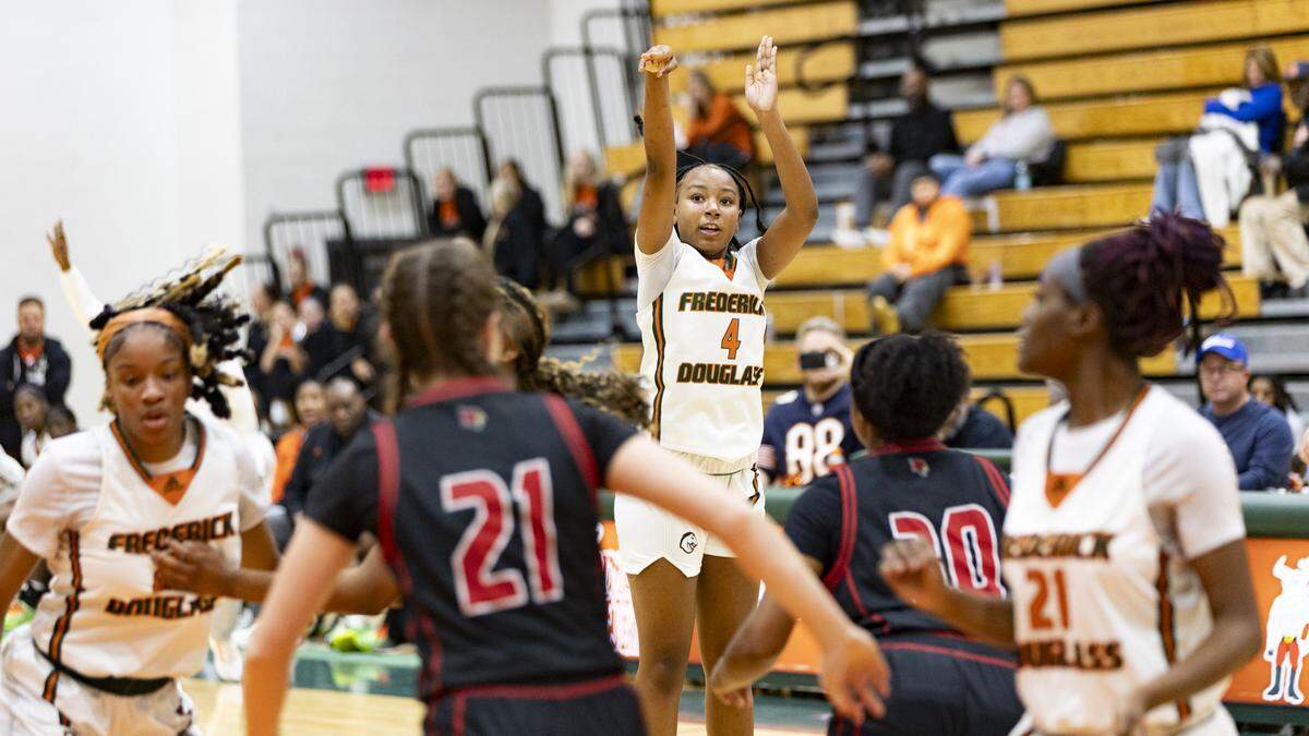 Frederick Douglass’ Mia Waide (4) tracked the flight of her 3-point attempt against Frederick Douglass during their game in the Douglass Holiday Showcase at The Farm on Saturday.