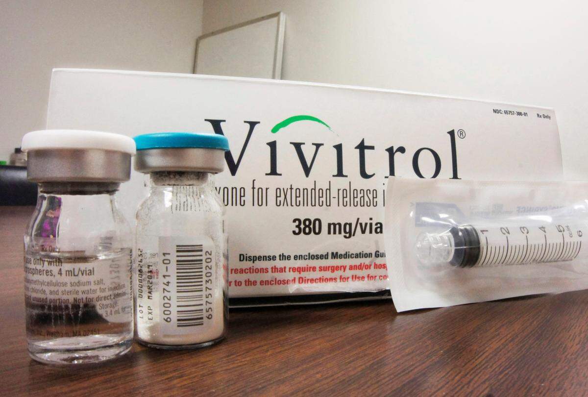 FILE - This Oct. 19, 2016, file photo shows the packaging of Vivitrol at an addiction treatment center in Joliet, Ill. A new study finds only 1 in 4 teens and young adults with opioid addiction receive recommended treatment medication despite having good health insurance. The research suggests that doctors are not keeping up with the needs of youth in the opioid addiction epidemic. The study was published Monday, June 19, 2017, in JAMA Pediatrics. (AP Photo/Carla K. Johnson, File)