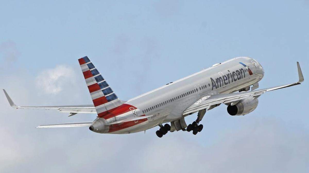 An American Airlines passenger jet takes off.
