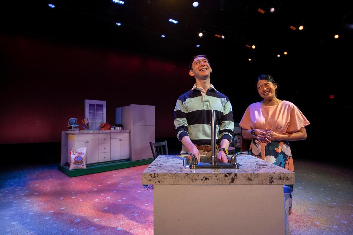 Rusty Allen, left, playing Lucas, and Kim Dixon, playing Emily, rehearse for “Shoyu Tell” which has its world premiere this weekend at the Lexington Children’s Theatre. The story is about a Japanese-American student whose lunchbox contents makes him the target of the school bully.