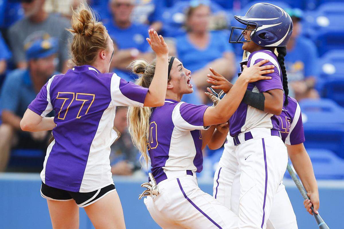 Male’s Madison McCoy (20) celebrates with Male’s Jaelyn Sanders (24) during the KHSAA State Softball Tournament championship against the Warren East at John Cropp Stadium in Lexington, Ky., Saturday, June 15, 2019. Male beat Warren East 6-1. 