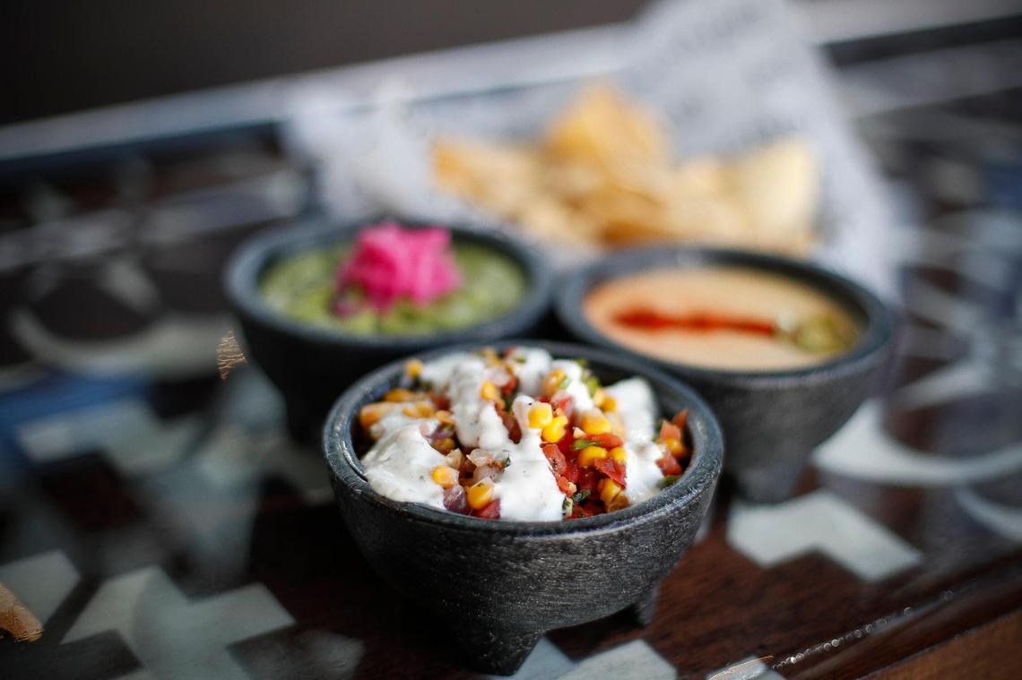 Corn salsa, guacamole, queso blanco and house-made tortilla chips at Condado Tacos at The Summit at Fritz Farm.