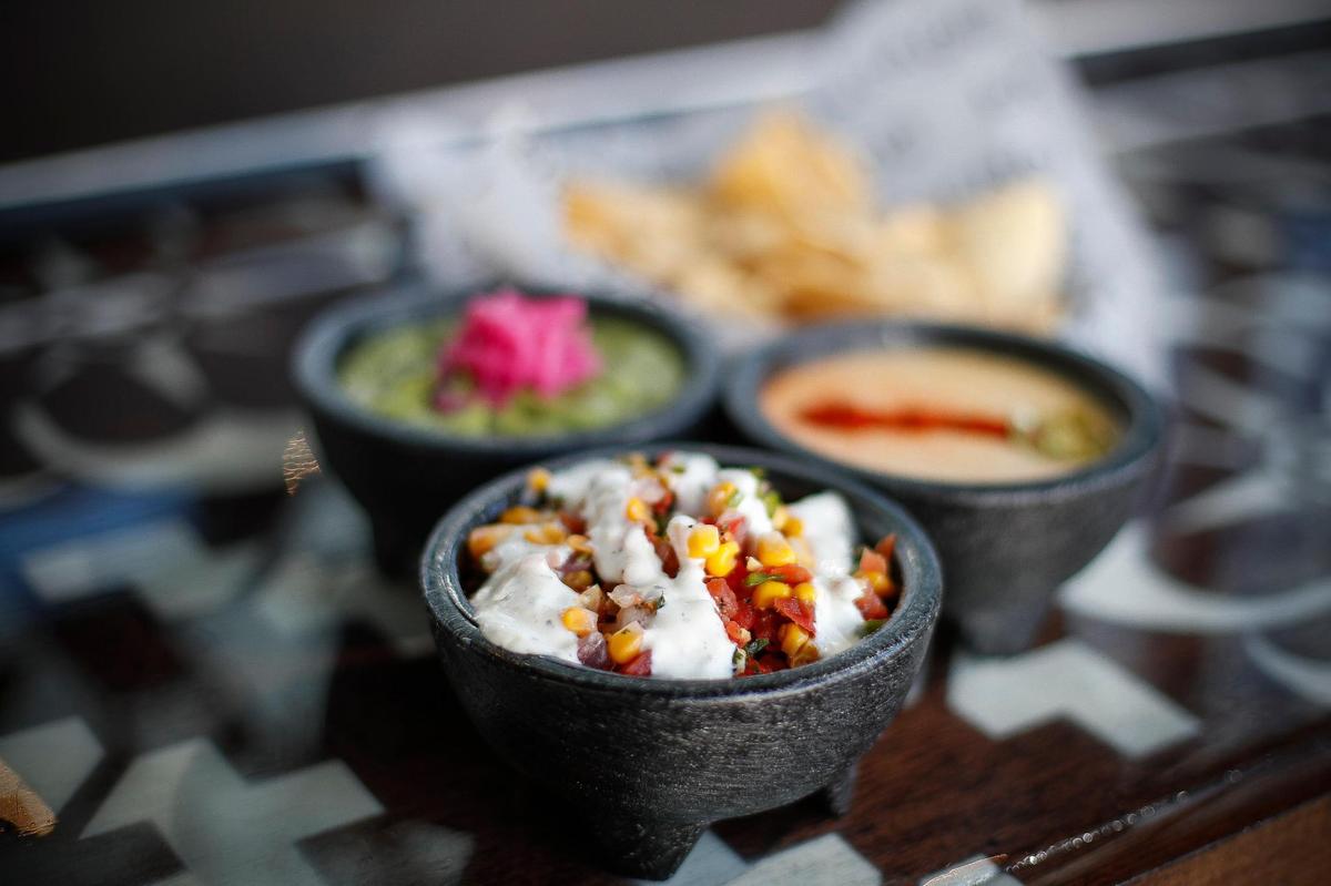 Corn salsa, guacamole, queso blanco and house made tortilla chips at Condado Tacos at The Summit at Fritz Farm.