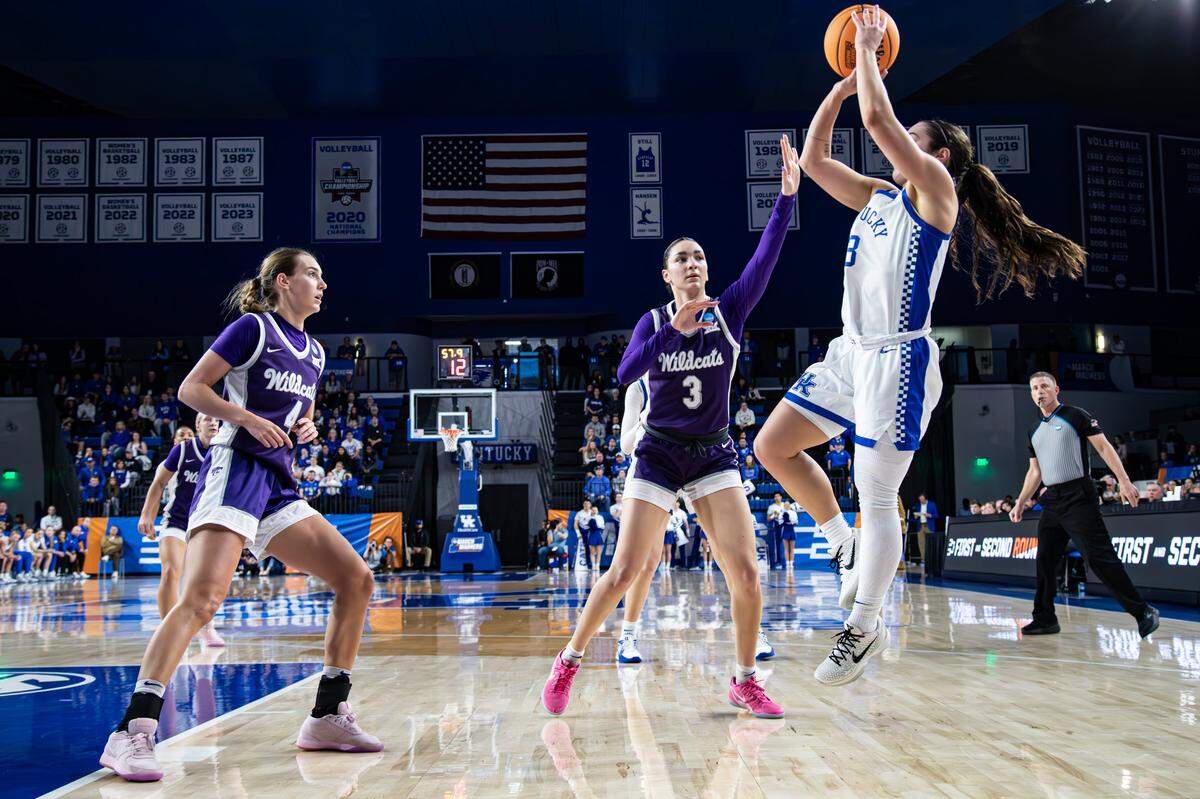 Kentucky’s Georgia Amoore (3) fades away for a shot against the defense of Kansas State’s Serena Sundell (4) and Brylee Glenn (5) in Memorial Coliseum on Sunday.