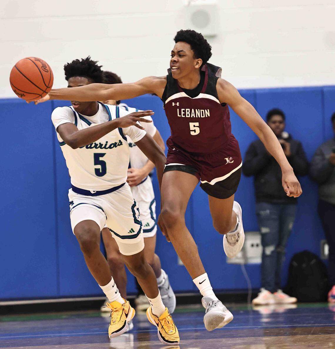 Lebanon forward Anthony Thompson (5) chases after a loose ball during their during their 50-61 loss to Winton Woods Friday, Jan. 5, 2024.