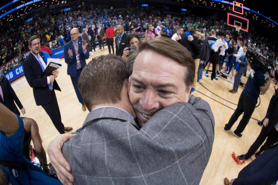 Saint Louis University men’s basketball coach and former Kentucky Wildcats point guard Travis Ford, facing forward, hugged his nephew and assistant coach Ford Stuen after the Billikens won the 2019 Atlantic 10 Conference Tournament championship. Stuen died May 11 at age 29 after falling ill with what Travis Ford says began as “a severe liver issue.”