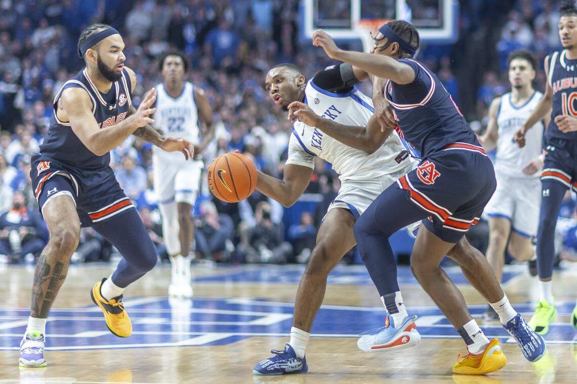Kentucky’s Lamont Butler (1) drives against Auburn’s Denver Jones (2) during Saturday’s game in Rupp Arena.