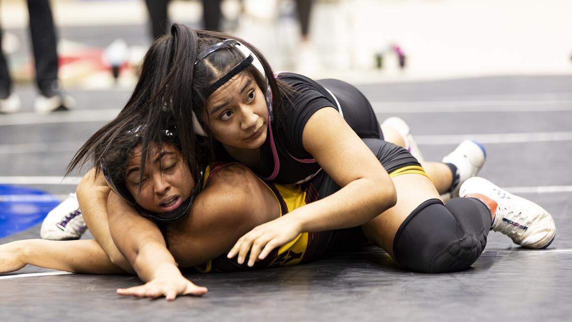 Lafayette’s Amy Velasco held down Harrison County’s Jenny White during the 145-pound finals of the 2026 KHSAA Girls State Wrestling Championships at the Kentucky Horse Park’s Alltech Arena on Saturday.