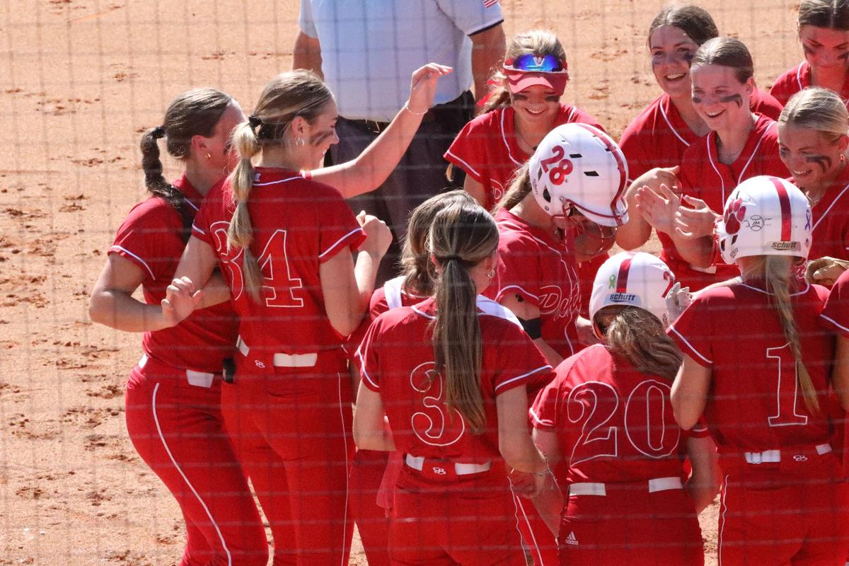 The Daviess County Panthers cheer on Molly Hancock (28) after her home run during the state softball tournament against Mercer County on Thursday at UK’s John Cropp Stadium.