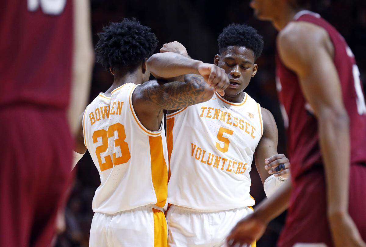 Tennessee guard Admiral Schofield (5) is congratulate by guard Jordan Bowden (23) after being fouled during the second half of an NCAA college basketball game against the South Carolina Wednesday, Feb. 13, 2019, in Knoxville, Tenn. Tennessee won 85-73. (AP photo/Wade Payne)