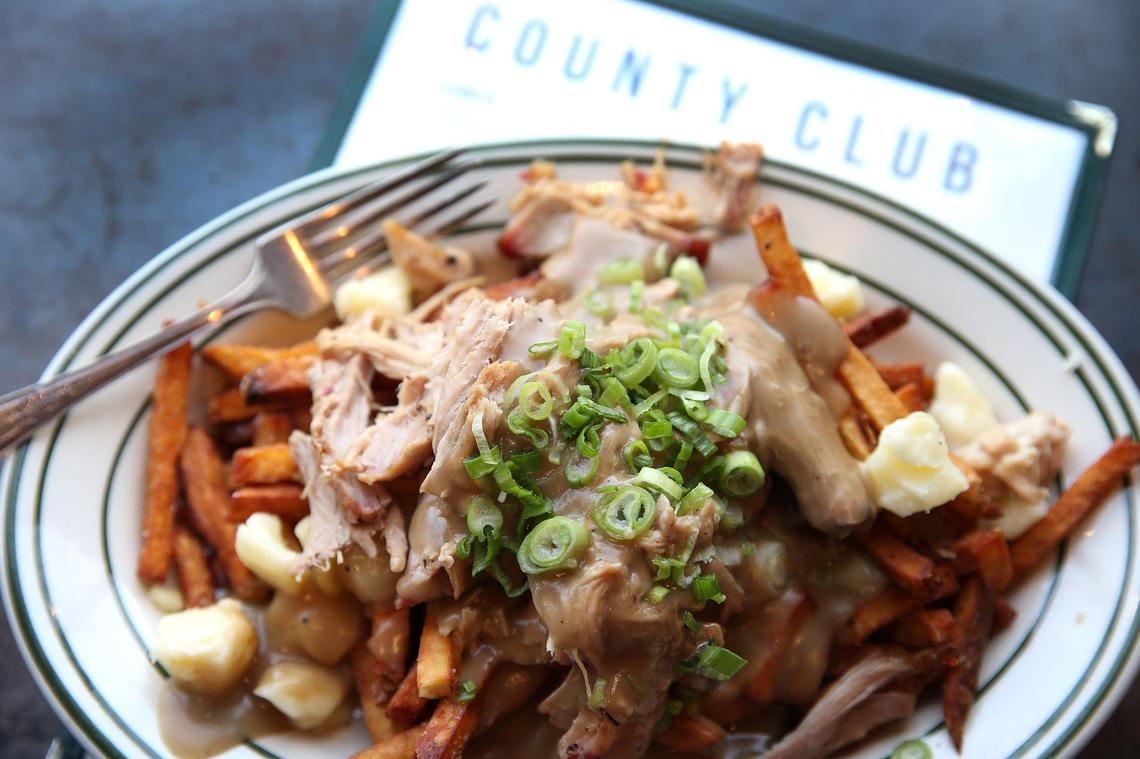 Poutine at County Club features locally sourced cheese curds.