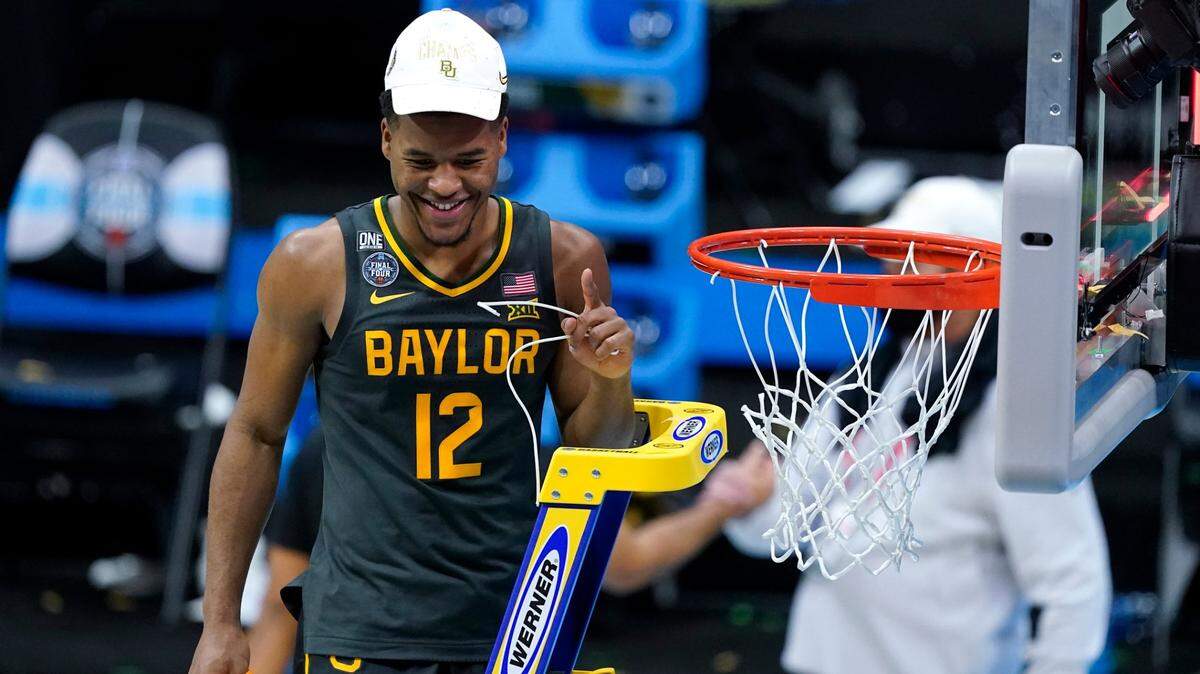 Baylor guard Jared Butler cut down the net after the NCAA championship game against Gonzaga on Monday night at Lucas Oil Stadium in Indianapolis. The Bears won 86-70.