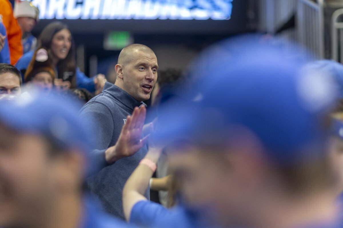 Kentucky head coach Mark Pope celebrates with fans following a second-round NCAA Tournament victory against Illinois at Fiserv Forum in Milwaukee on Sunday.
