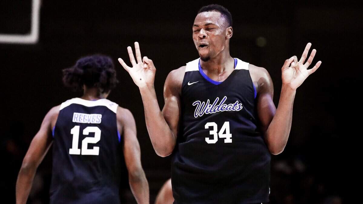 Oscar Tshiebwe, right, celebrates a made three-pointer by teammate Antonio Reeves in Kentucky’s win against the Bahamas National Select Team on Sunday, Aug. 14, 2022, in Nassau, Bahamas.