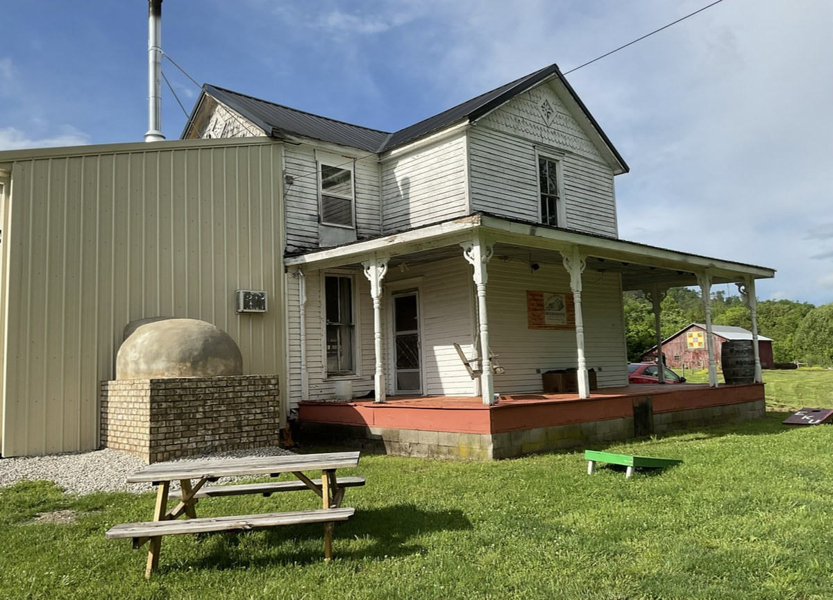 The farmhouse on the 600-acre family farm in Estill County serves as a cafe where they make pizzas and offer moonshine tastings.