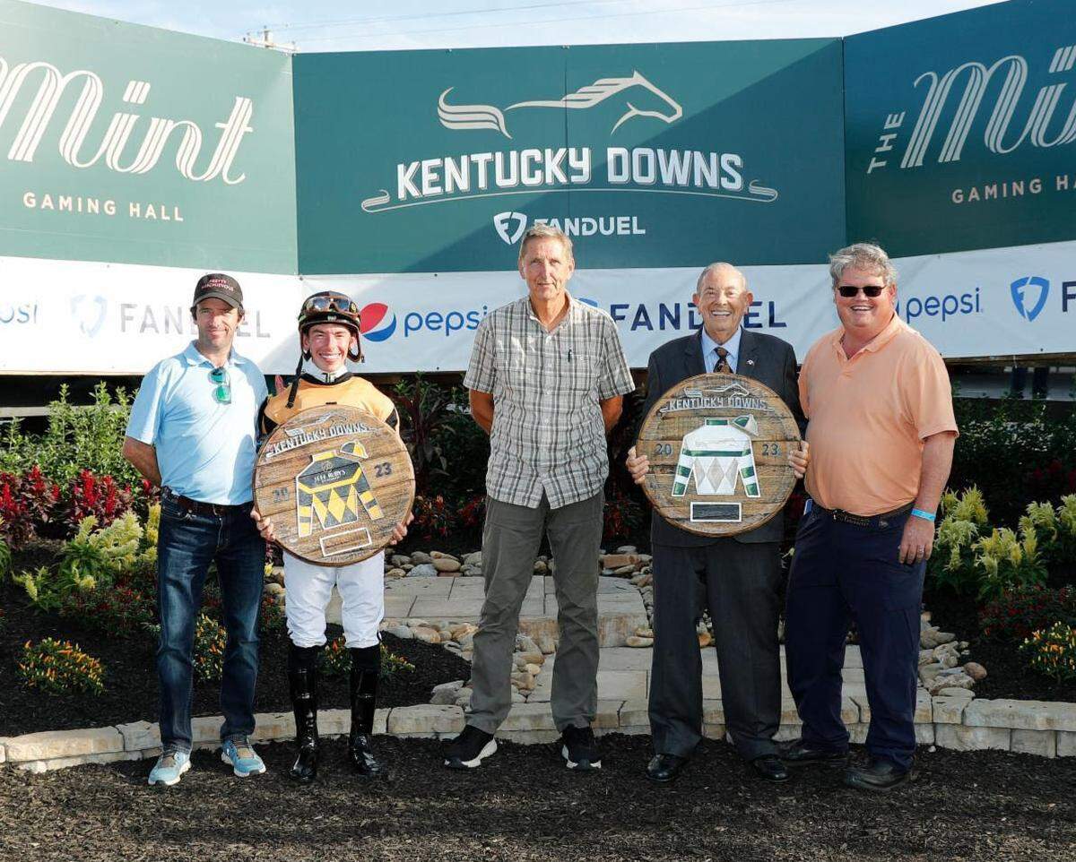 Ken Ramsey, second from right, was honored as the winningest owner at the 2023 Kentucky Downs meet. Pictured with him from left to right were Paul Madden, assistant to leading trainer Brendan Walsh; leading jockey Tyler Gaffalione, Ramsey Farm manager Mark Partridge and Ken’s son Jeff.