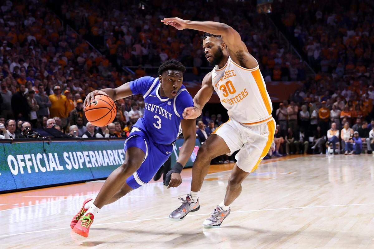 Kentucky guard Adou Thiero (3) dribbles against Tennessee guard Josiah-Jordan James (30) during Saturday’s game at Thompson-Boling Arena in Knoxville.