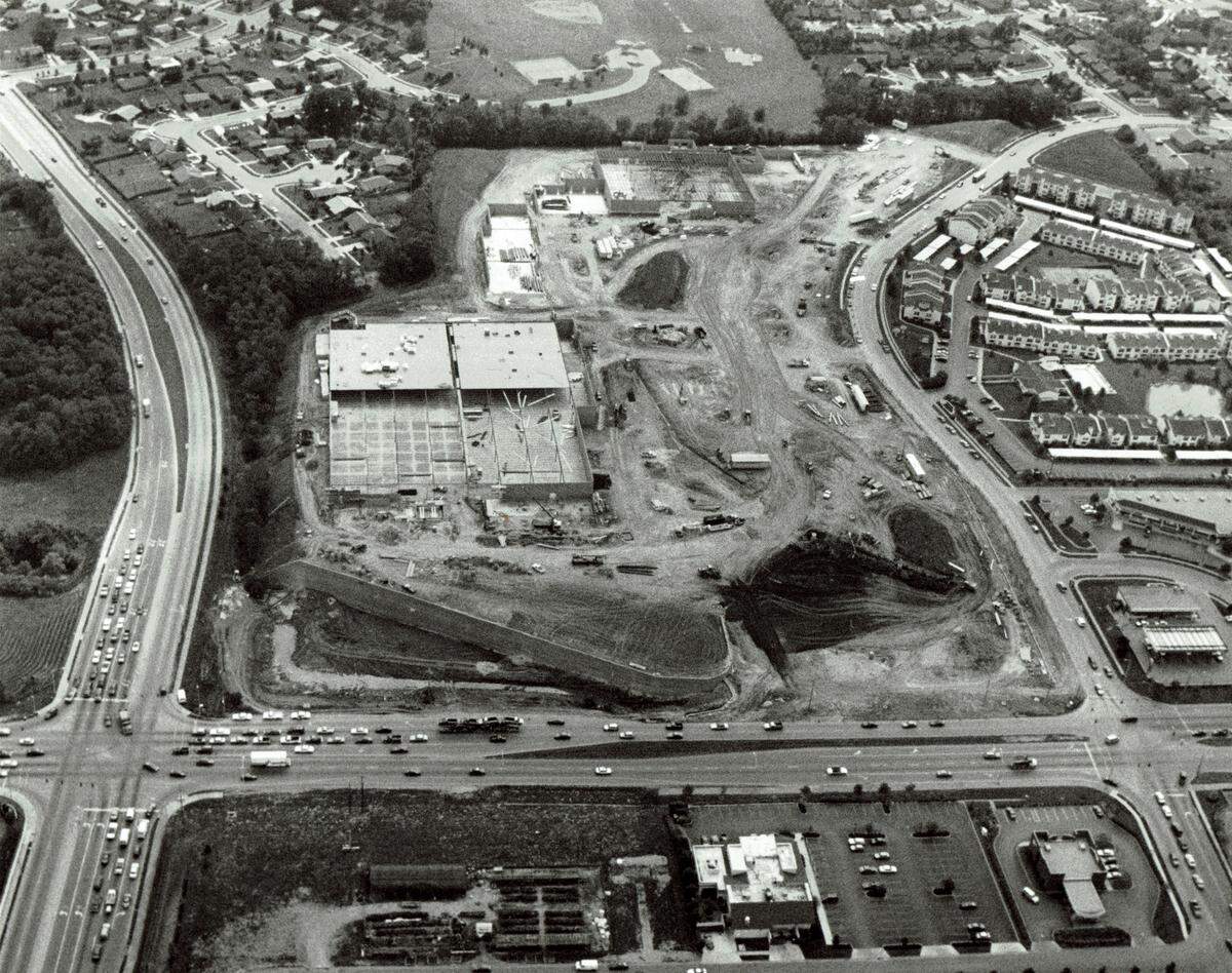 Aerial photo of construction of the Mist Lake Plaza shopping center at the corner of Richmond Road and Man O’War Blvd on June 2, 1993. The site included a 360 foot retaining wall that ranged in height from 5 feet to 35 feet and contained 17,000 to 18,000 blocks. It was the highest keystone block wall in Kentucky at the time of construction. The plaza contained the city’s first Walmart.