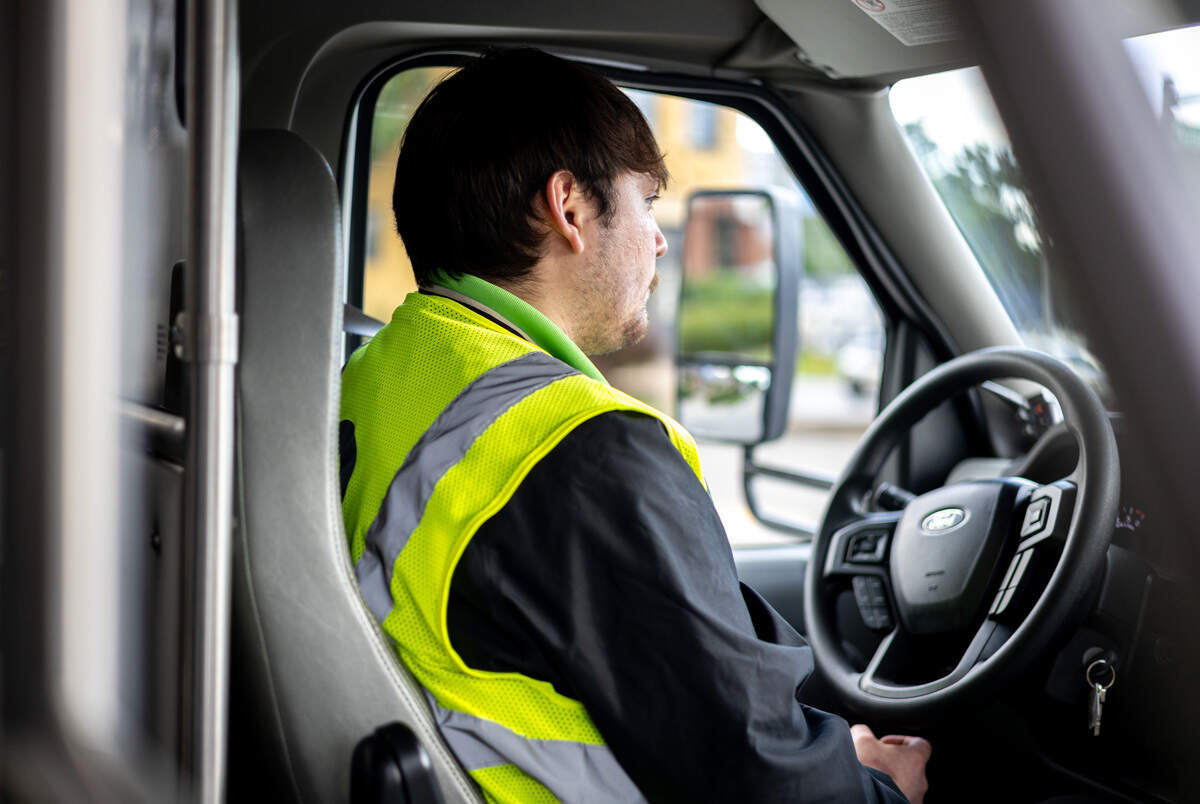 LexRide Operator Alfredo Cruz sits behind the wheel of one of the four new buses for the pilot program, which offers free rides from downtown Lexington to the Distillery District and Warehouse Block on the weekends.