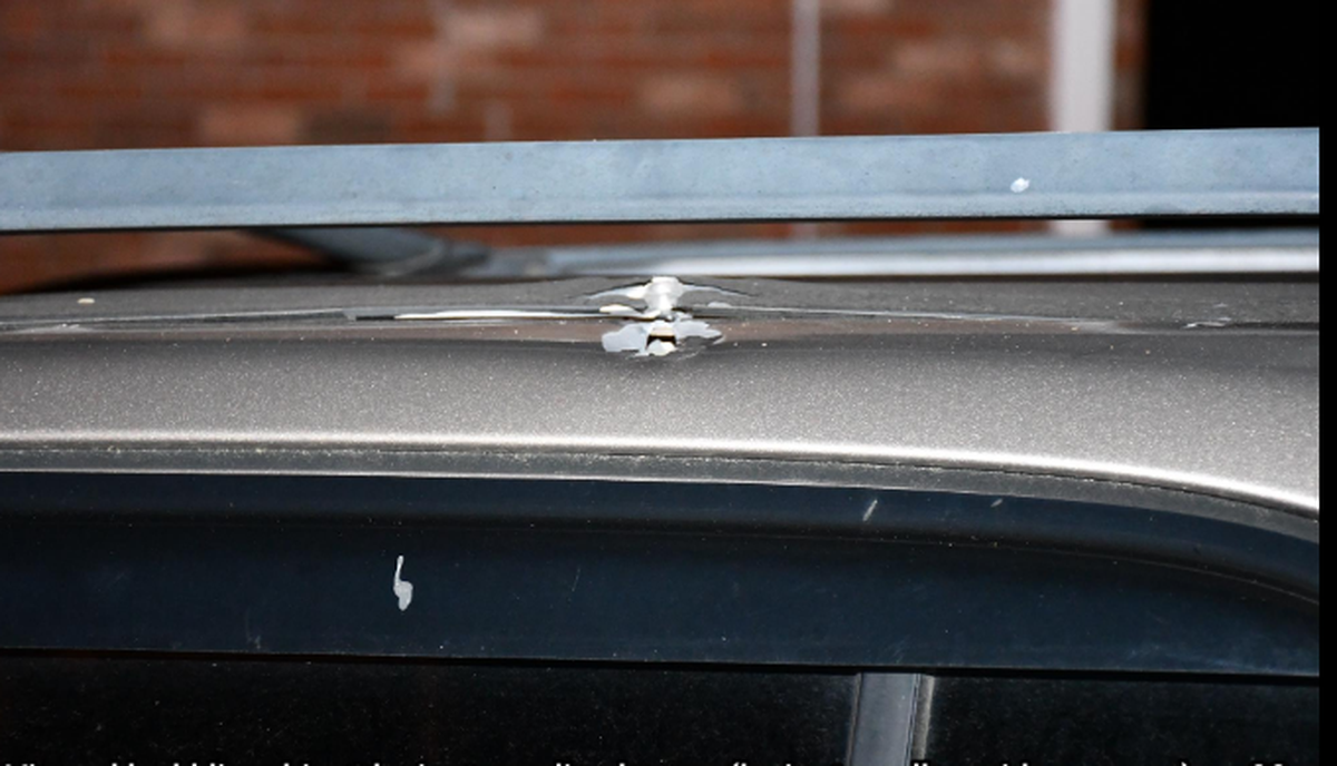 An unoccupied vehicle is damaged as a result of a shooting on Cummins Court in Lexington, Ky. on April 22, 2024.