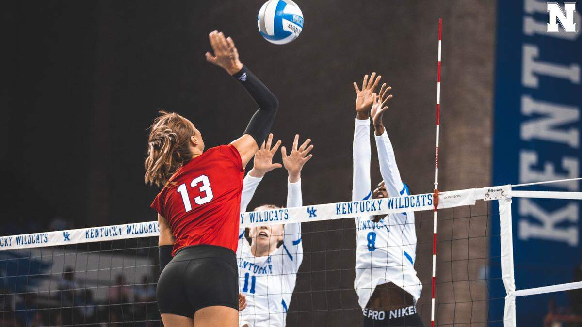 Kentucky’s Elise Goetzinger (11) and Adanna Rollins (8) try to block an attempt by Nebraska’s Whitney Lauenstein (13) during Sunday’s match in Memorial Coliseum. The Wildcats fell to 5-4 on the season with the loss.