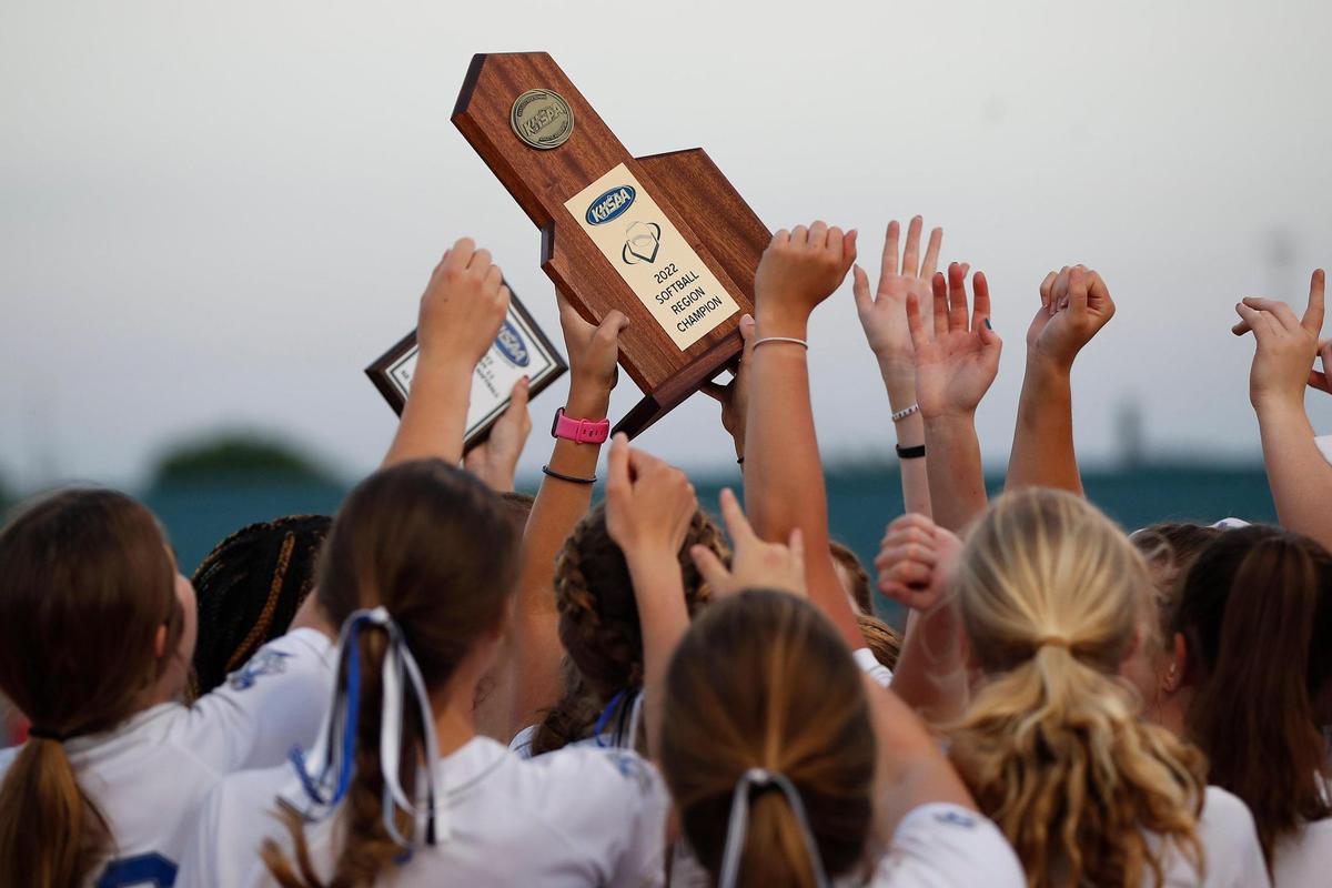 Lexington Catholic raises a region tournament softball trophy for the first time since 1997 after Wednesday night’s win.