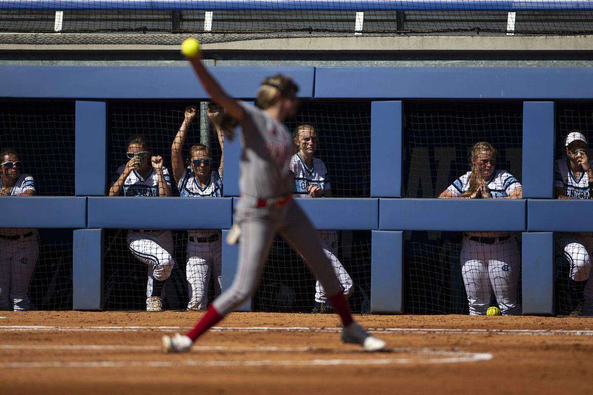 Central Hardin players watch as Pendleton County’s Kaylee Bruener pitches during a KHSAA State Softball Tournament quarterfinal game Friday, June 14, 2019, at University of Kentucky’s John Cropp Stadium.