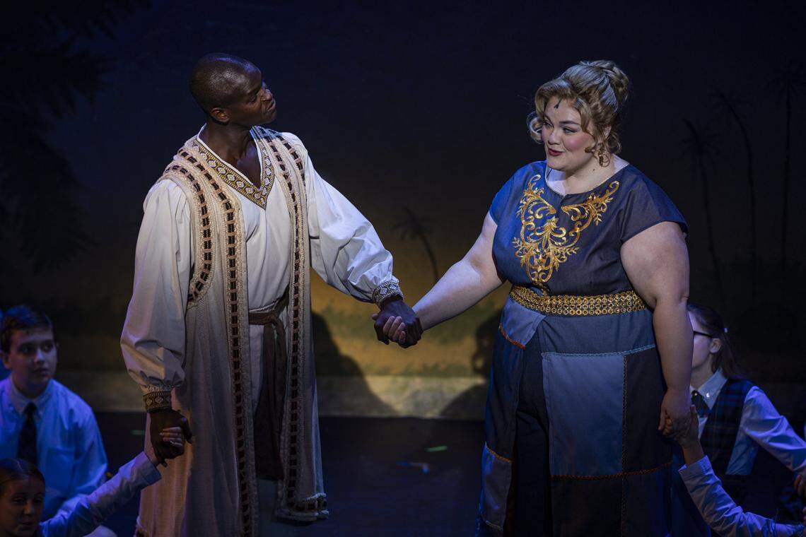 Darien Sanders, left, and Audrey Belle Adams hold hands during a rehearsal of Joseph and The Amazing Technicolor Dreamcoat Monday, July 28, 2025, at the Lexington Opera House in Lexington, Ky.