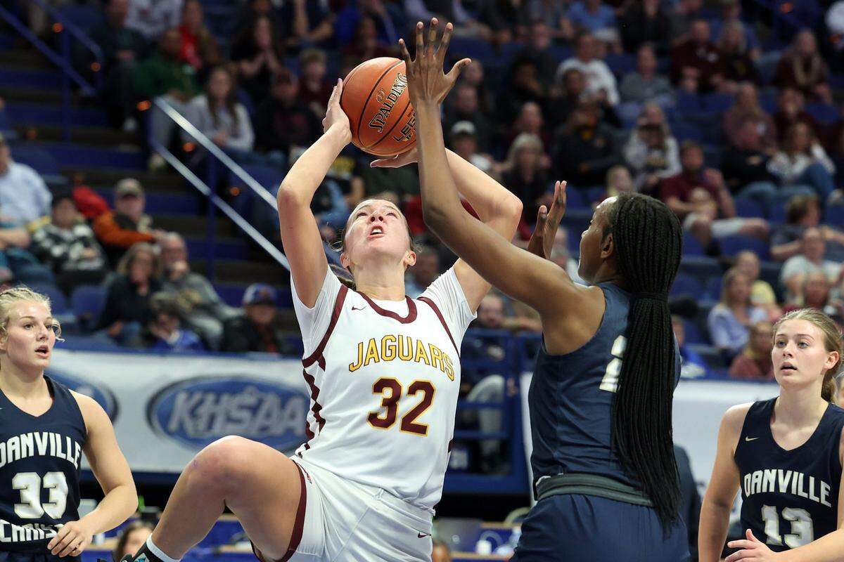 Liz Freihofer (32) is pressured by Danville’s Grace Mbugua (23). Freihofer finished with 14 points, five rebounds and three assists.
