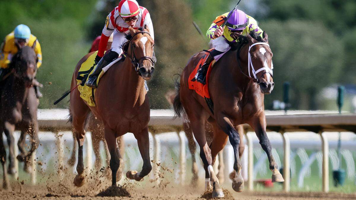 Flavien Prat guides Key of Life, right, to victory in the Beaumont for trainer Brad Cox and owner Flurry Racing on Sunday at Keeneland.