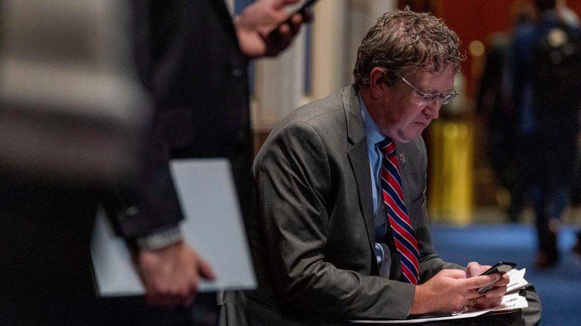 Rep. Thomas Massie, R-Ky., looks at a smart phone as Attorney General Merrick Garland testifies before a House Judiciary Committee oversight hearing of the Department of Justice on Capitol Hill in Washington, Thursday, Oct. 21, 2021. (AP Photo/Andrew Harnik)