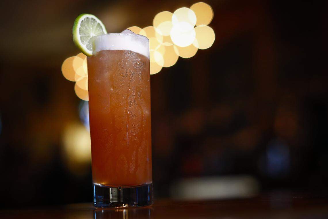 That Tequila Thing, made with tequila, pineapple juice, lime juice, simple syrup, vanilla extract, bitters served over ice and garnished with slice of lime at Arcadium. The new owners say they plan to have a rotating menu of craft cocktails.
