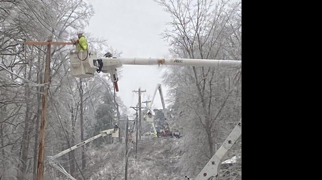 Kentucky Power crews worked on Feb. 15 to restore electricity in northeastern Kentucky after ice knocked out power to thousands of homes and businesses.