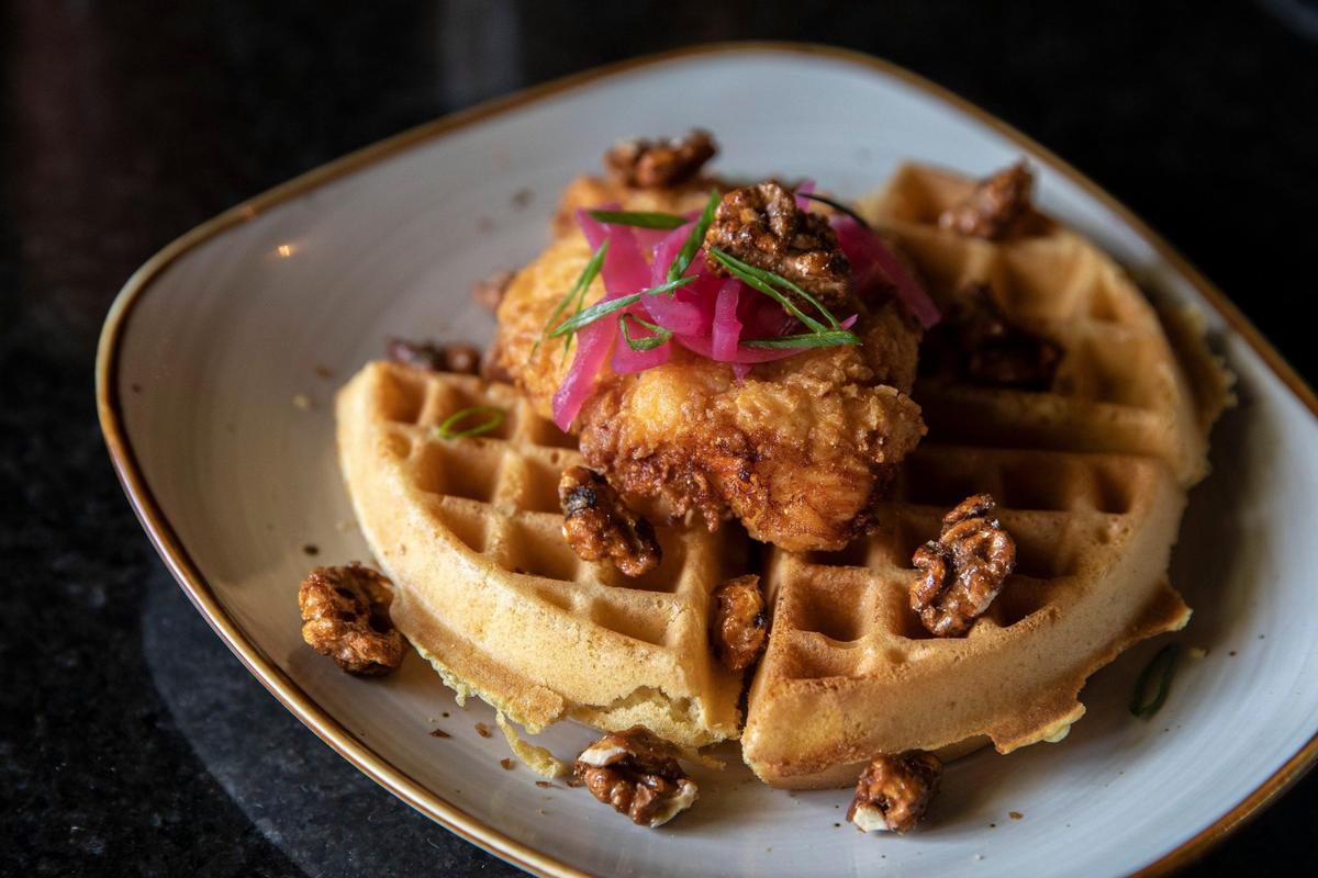 Chicken and waffles, with spiced walnuts and bourbon maple syrup on the Sunday brunch buffet at Ranada’s Bistro + Bar.