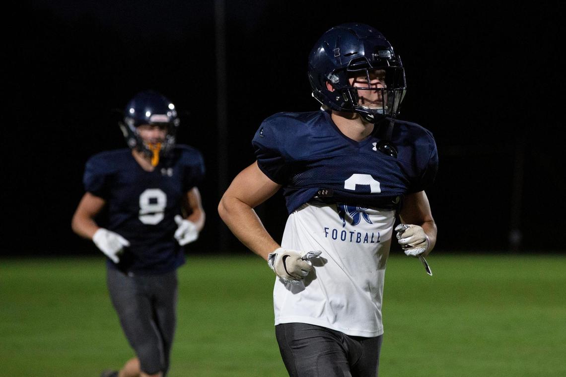 Sayre Spartans senior wide receiver Michael Madden, right, and junior wide receiver Jackson Marshall ran back after a drill during practice at the Sayre Athletic Complex.