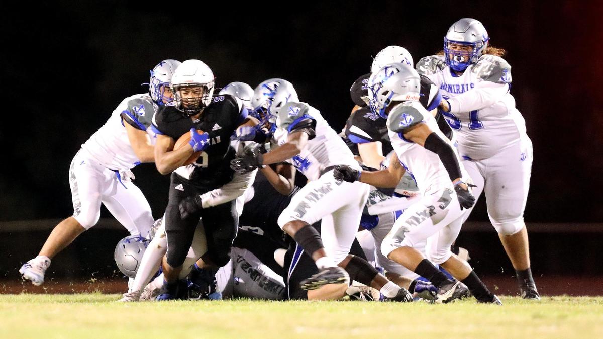 Lexington Christian’s Jeremiah Riffle (9) breaks through several Danville defenders during their game in the regular season. The teams collide again in Friday night’s second round of the Class 2A playoffs.