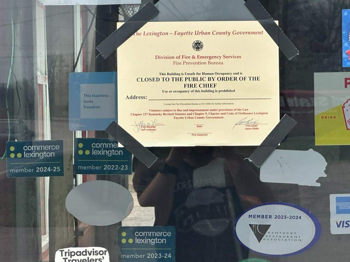 A sign on the door of Red State BBQ on Georgetown Road confirmed it was closed by the fire chief after a car struck and damaged the building.